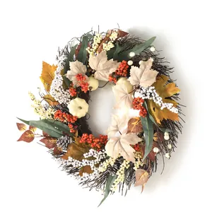 Autumn wreath with white pumpkins, maple leaves and pine cones on a white background