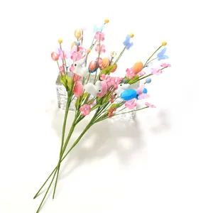 Detailed view of Easter decorative floral picks with colorful eggs and rabbits