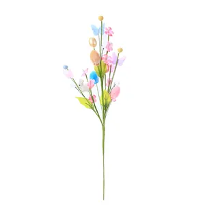 Easter decorative branch with pink flowers, colorful eggs and rabbit figures on white background