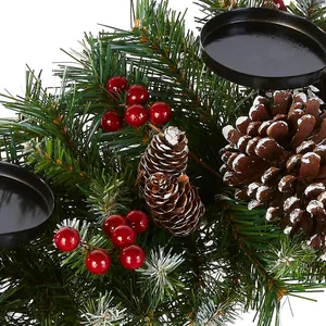 Christmas candle holder with faux pine needles, red berries and snow-covered pine cones