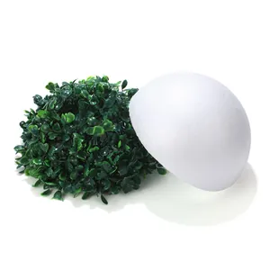Artificial harvest hanging basket with realistic green foliage on white foam base