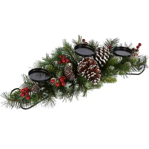 Christmas candle holder centerpiece with pine needles, red berries and 3 candle cups