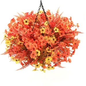 Detail view of artificial hanging basket with orange flowers and black metal chains