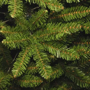 Close-up of dense green PVC pine needles and realistic branch detail on a 2.1m Christmas tree