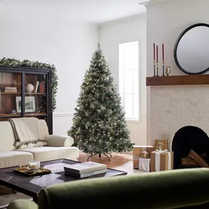 2.1m green PVC Christmas tree with warm LED lights and pine cones on a metal stand