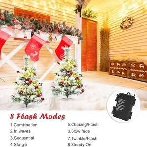 Green Christmas tree garden stakes with LED lights, snow effect, and 8 lighting modes