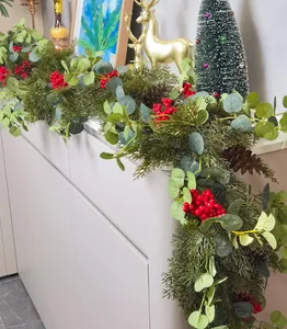 Detail of 1.8m Christmas garland with red berries, pine cones and green eucalyptus leaves