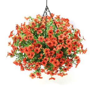 Close-up of artificial autumn hanging basket with orange flowers and metal chains