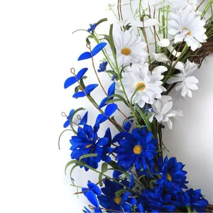 Independence Day wreath with red white and blue flowers on natural rattan base