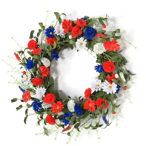 Patriotic July 4th front door wreath with red, white, and blue flowers on rattan base