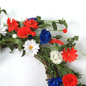 Patriotic July 4th door wreath with red white and blue flowers on natural rattan