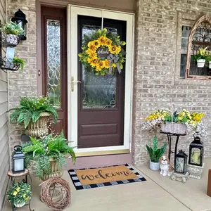 Sunflower welcome wreath with green leaves and black-white plaid bow for home door decor
