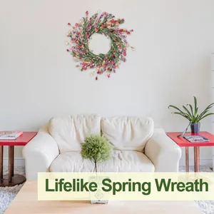 Lifelike spring wreath featuring colorful wildflowers on a white wall above a cozy sofa