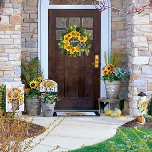 Detailed view of sunflower welcome wreath with plaid bow on a rustic wooden door