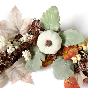 Autumn wreath with white pumpkins, berries, and maple leaves for Thanksgiving decor