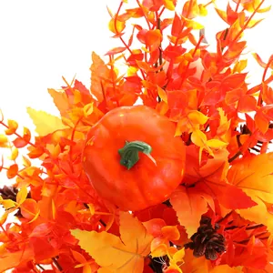Close-up of autumn artificial lavender set with pumpkin, maple leaves and pine cones