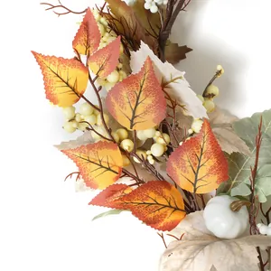 Autumn harvest garland with white pumpkin maple leaves and berries on white background