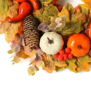 Autumn wreath with pumpkins, pinecones, and maple leaves for Thanksgiving door decoration
