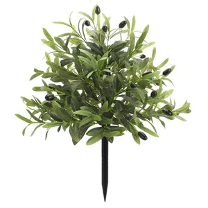 Artificial olive tree with lush green leaves and black fruits on a ground plug-in stem