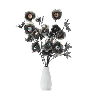 Halloween black rose bouquet with realistic eyeballs in a white vase for home decor