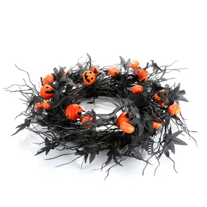 Halloween wreath with black maple leaves and orange pumpkins on a white background