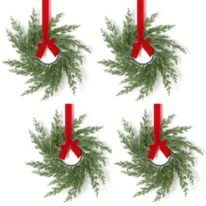 Set of 4 Christmas pine wreaths with red velvet ribbons on white background