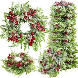 Ensemble couronne de bougies de Noël avec baies rouges pommes de pin et neige artificielle