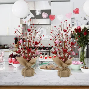 Set of two Valentine's Day berry trees with red and pink hearts on a rustic burlap base