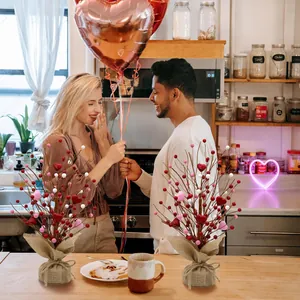 Valentine desktop berry tree with heart-shaped fruit and rustic burlap base on dining table