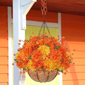 Detail of hanging basket with artificial orange dahlias and natural coco liner texture