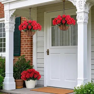 Artificial red geraniums in hanging coconut fiber baskets for outdoor home porch decor