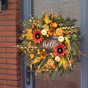 Close-up of autumn wreath with sunflowers and white pumpkins featuring hello greeting sign