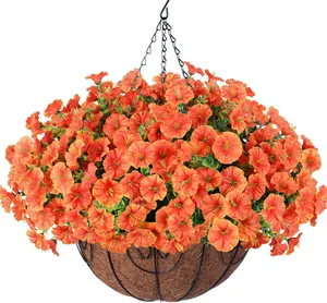 Artificial orange flowers in a coconut fiber hanging basket with black metal chain