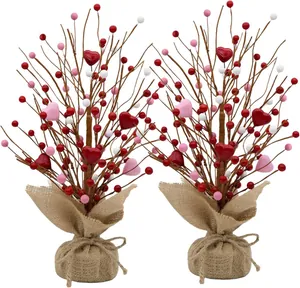 Macro view of twin Valentine berry trees with Love heart accents and burlap base