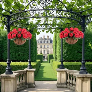 Detail of outdoor hanging baskets with red artificial geraniums in garden setting