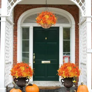 Hanging coconut fiber basket with vibrant orange autumn faux mums and potted patio decor