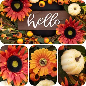 Fall wreath with orange sunflowers, white pumpkins, and berries featuring a Hello sign