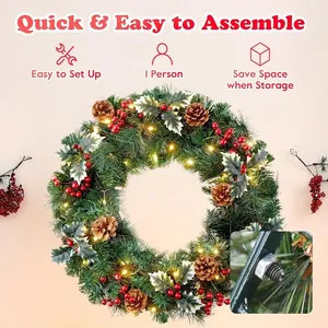 Couronne de Noël avec aiguilles de pin, cônes et baies rouges à lumières LED chaudes