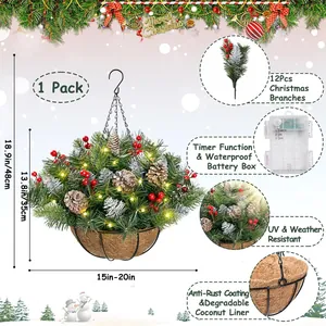 Panier de Noël suspendu avec branches de pin enneigées, baies rouges, cônes et LED
