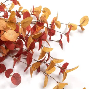 Artificial autumn eucalyptus stems with red and orange leaves for home and office decor