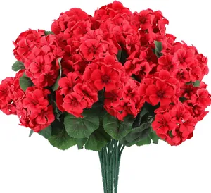 Macro detail of vibrant red artificial geranium silk flowers with realistic green stems