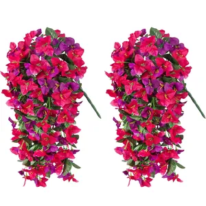 Detail of two artificial bougainvillea hanging vines with vivid magenta and purple silk petals