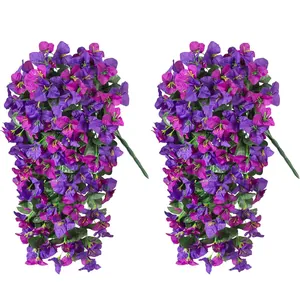 Detailed view of two hanging artificial bougainvillea bundles with purple and magenta flowers