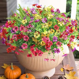 Outdoor tall beige planter with colorful artificial eucalyptus and morning glory flowers