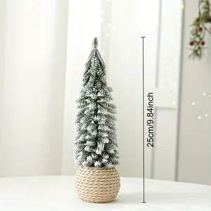 Detail of 25cm mini flocked Christmas tree with snow effect and woven rope base