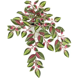 Close-up of realistic artificial vine leaves with vibrant green and pink vein textures