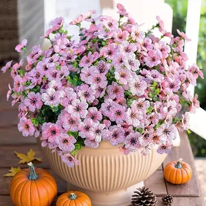 Detailed view of pink faux petunias with purple veins in a beige ceramic planter pot