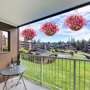 Three hanging flower baskets with coco liners and vibrant purple artificial daisy blooms