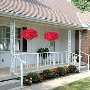 Outdoor hanging basket with red artificial bougainvillea flowers on a white porch