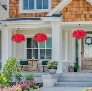 Three vibrant red artificial bougainvillea hanging baskets on a modern porch